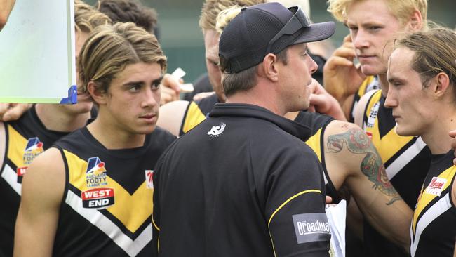 Brighton coach Joel Tucker addresses his players. Picture: AAP/Dean Martin