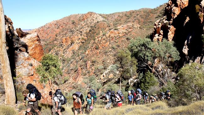 Walkers on the Larapinta Trail in the West MacDonnel Ranges, which will remain off the agenda for most Australians for another 18 months.