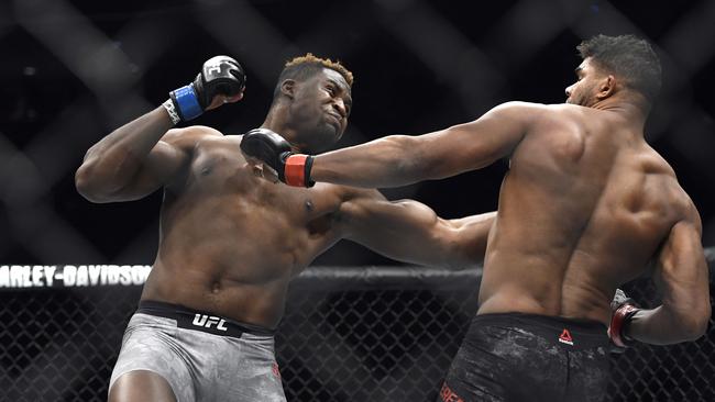 Francis Ngannou, left, hits Alistair Overeem in the first round during a UFC 218 heavyweight mixed martial arts bout, Saturday, Dec. 2, 2017 in Detroit. Ngannou defeated Overeem by first-round knockout. (AP Photo/Jose Juarez)