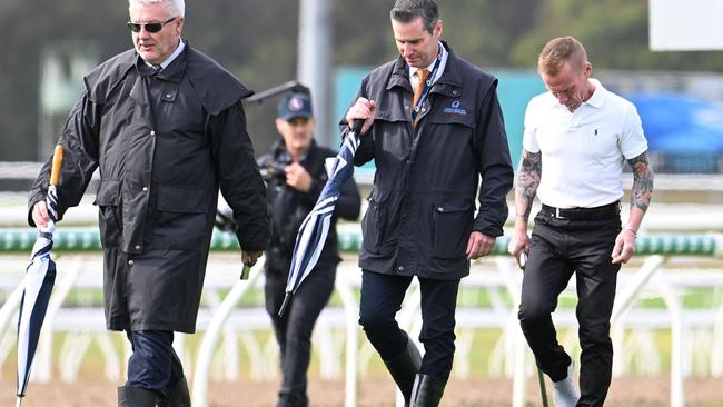 Stewards Paul Zimmerman (left) and Geoff Goold (middle) inspect the Sunshine Coast track with jockey Jim Byrne (right). Picture: Grant Peters - Trackside Photography