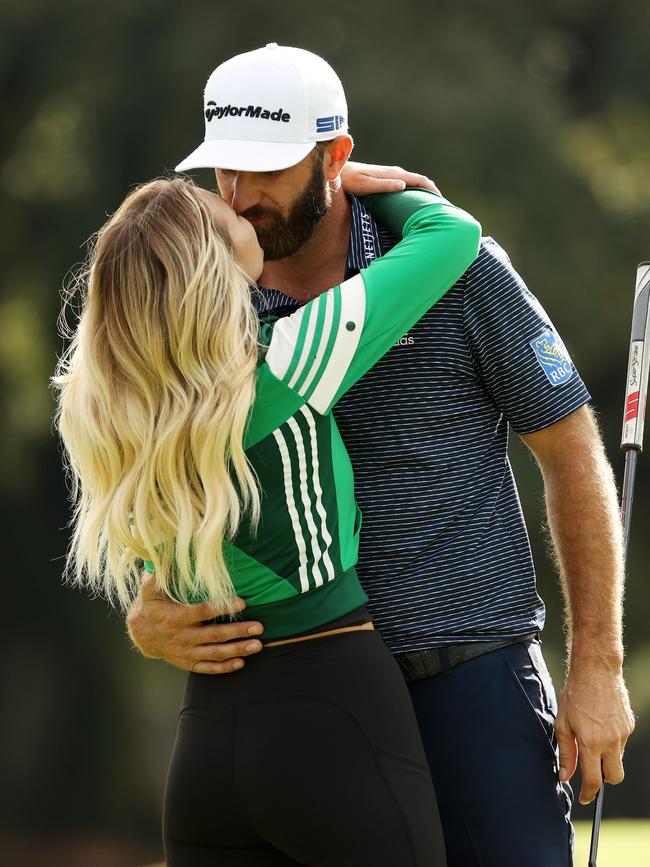 Celebrating with Dustin Johnson after he won last year's Masters. (Photo by Patrick Smith/Getty Images)