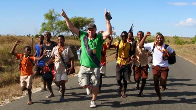 Running with the locals in Madagascar. Picture: Newsmodo