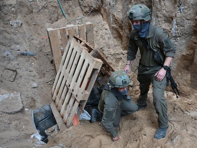 Israeli soldiers emerge from a tunnel dug by Hamas militants inside the Al-Shifa hospital complex in Gaza City. Picture: AFP