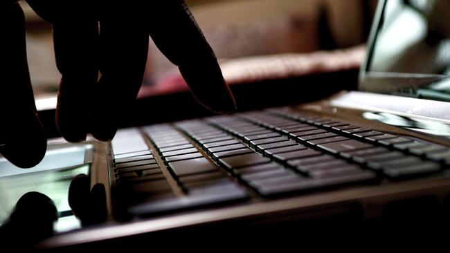 cyber crime hacker typing on laptop Photo: istock