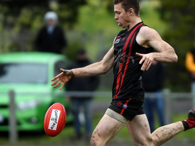 Aaron Holden of Hampton kicks the footy during the Southern Football League division three grand final, Heatheron, Melbourne, Sunday, September 8, 2019. Hampton Park v Clayton. (AAP Image/James Ross) NO ARCHIVING