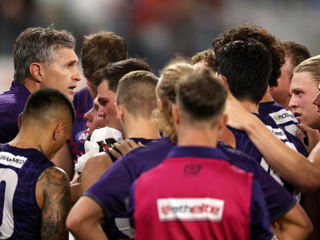 PERTH, AUSTRALIA - MAY 24: Justin Longmuir, Senior Coach of the Dockers addresses the team at the quarter time break during the 2024 AFL Round 11 match between Walyalup (Fremantle) and the Collingwood Magpies at Optus Stadium on May 24, 2024 in Perth, Australia. (Photo by Will Russell/AFL Photos via Getty Images)