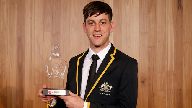 Zak Butters with his AFL Coaches Association Most Courageous Player Award. Picture: Dylan Burns/AFL Photos via Getty Images