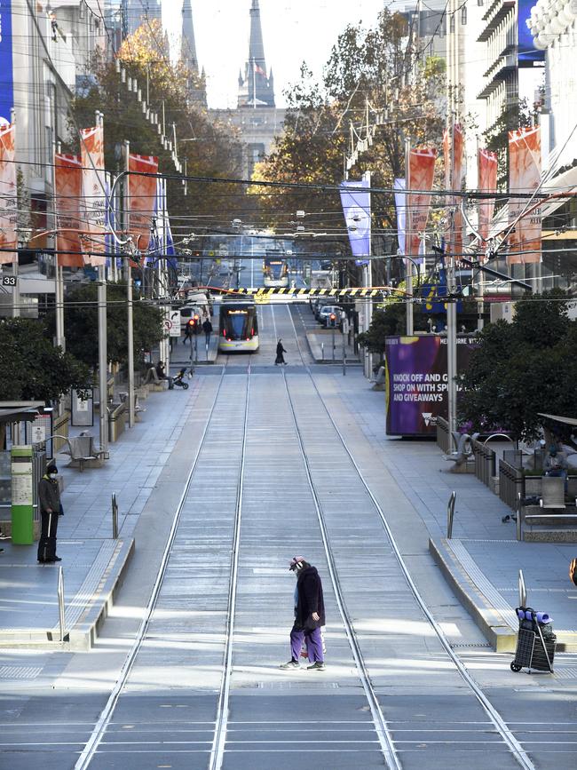 Melbourne’s Bourke Street in central Melbourne is almost deserted. Picture: NCA NewsWire / Andrew Henshaw