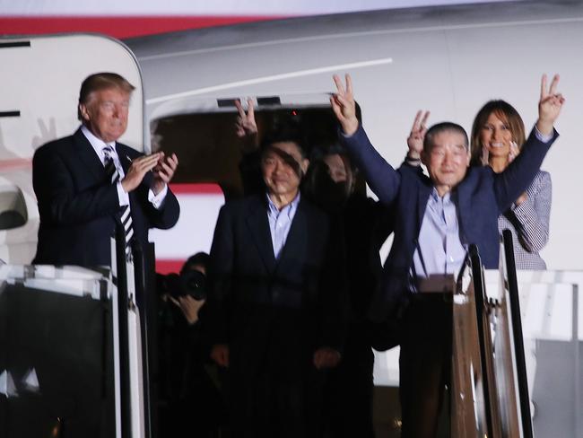 US President Donald Trump applauds the three Americans just released from North Korea, Kim Dong Chul, Kim Hak-song and Tony Kim at Joint Base Andrews. Picture: Getty