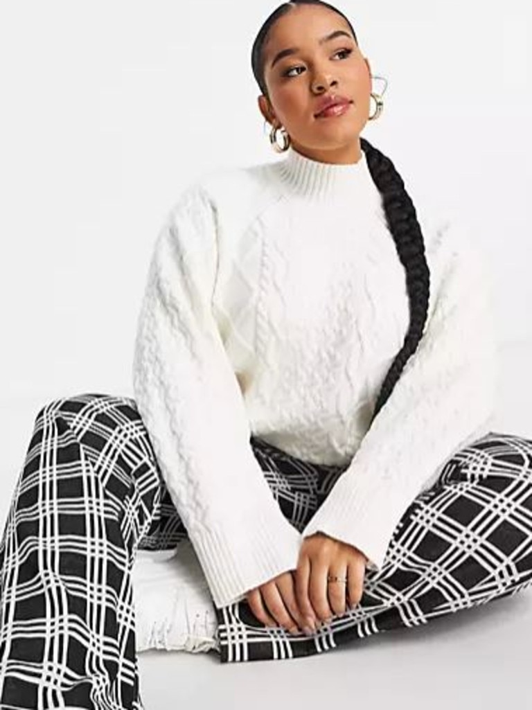 ASOS DESIGN Curve high neck cable jumper with wide sleeves. Picture: ASOS.