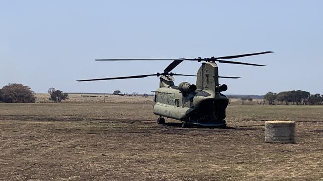 An army helicopter carries in hay to the farmers of Kangaroo Island. Pictures: Danielle Short