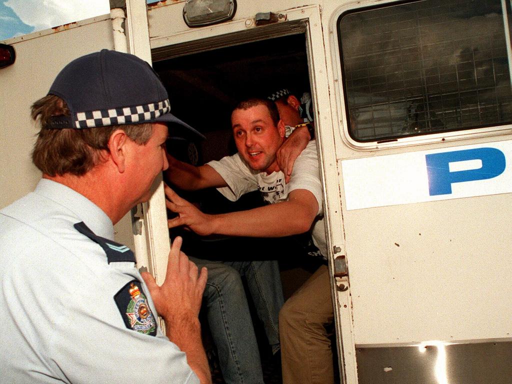 Protester being loaded into a police van during a One Nationa meeting in Toowoomba, July 1997.