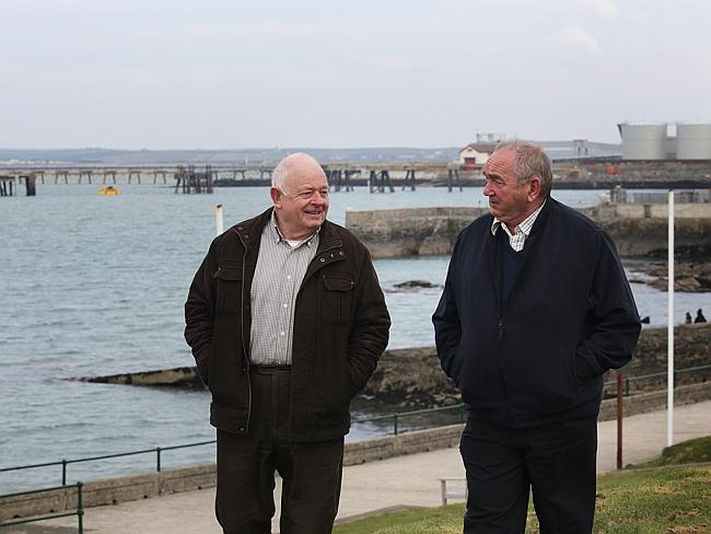 Change ahead ... Holyhead mayor Ronnie Williams with councillor and incoming mayor John Owen at the Marina with the jetty in the background where ships with alumina and coke coming from Australia were docking. Picture: Ella Pellegrini