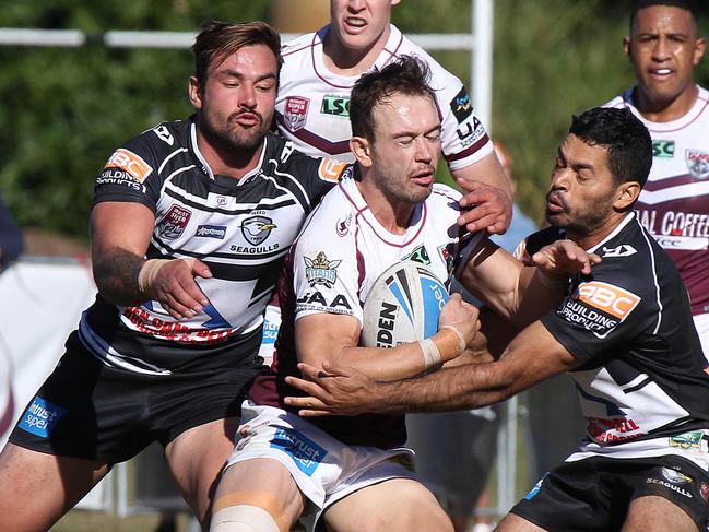 Burleigh’s Kurtis Rowe takes on the Tweed defence in last year’s Intrust Super Cup. Picture: Mike Batterham