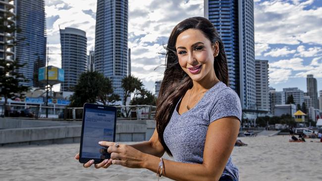 Charlotte Cush, from Robina, holding a Samsung tablet in Surfers Paradise, for the Gold Coast Bulletin's latest digital subscription promotion. Picture: Jerad Williams