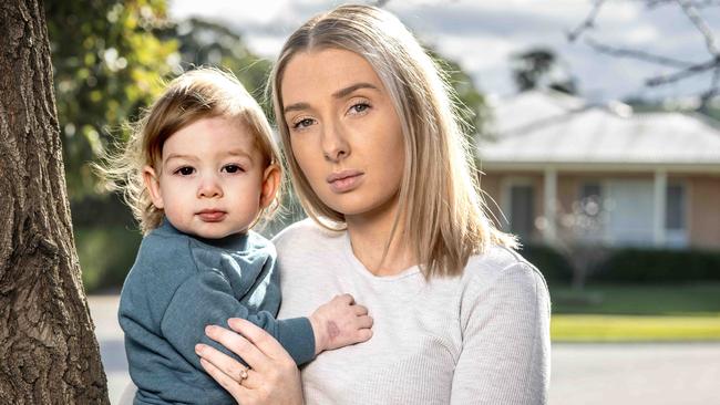 Brodie Collins-Roberts and her one-year-old son, Koah, who needed surgery and a skin graft after an IV drip burnt a hole in his hand. Picture: Tony Gough