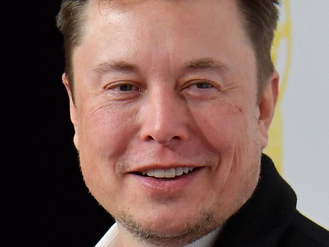 (FILES) In this file photo taken on November 12, 2019 Elon Musk, CEO of Tesla and SpaceX, poses on the red carpet as he arrives for the 43rd 