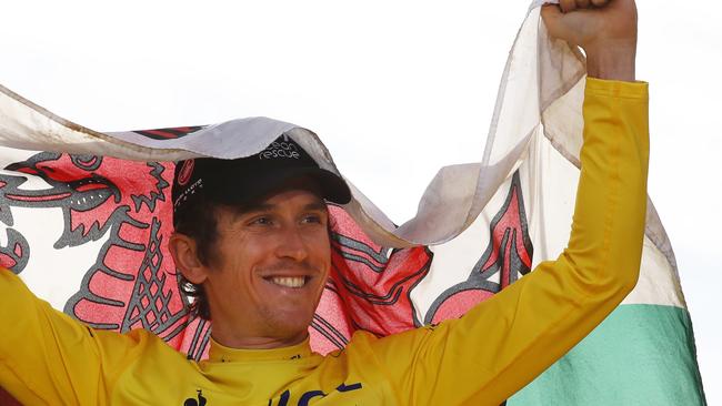 Proud Welshman Geraint Thomas celebrates his Tour de France victory. (AP Photo/Christophe Ena )