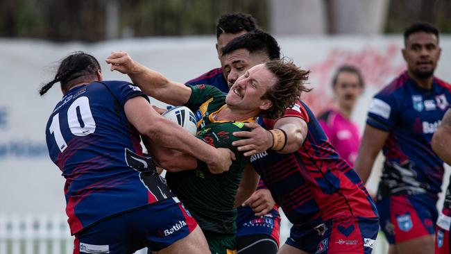 Lions player Rhys Peters is stopped by the Collegians defence. Pics by Julian Andrews.
