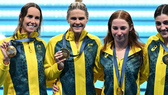Gold medallists Australia's Mollie O'callaghan, Australia's Shayna Jack, Australia's Emma Mckeon and Australia's Meg Harris pose with their medals following the women's 4x100m freestyle relay swimming event at the Paris 2024 Olympic Games at the Paris La Defense Arena in Nanterre, west of Paris, on July 27, 2024. (Photo by Manan VATSYAYANA / AFP)