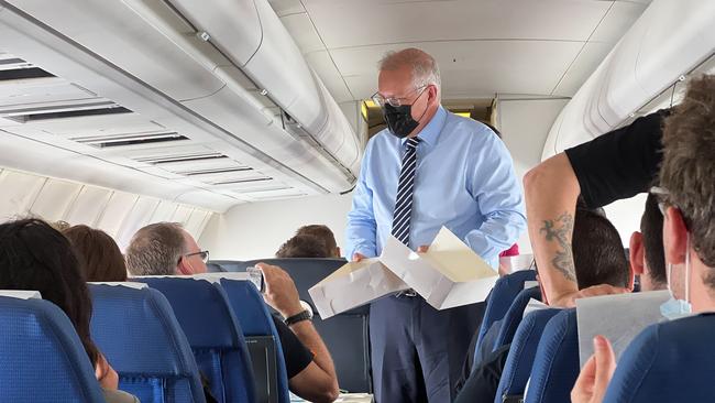 Supporter of Deves... Prime Minister Scott Morrison on the media plane yesterday. Picture: Jason Edwards