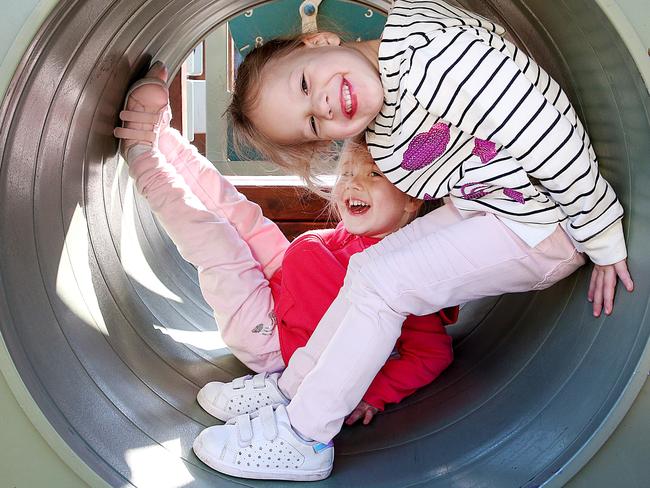 Twins Alyssa and Sienna, 4, enjoy playing up, but aren’t taking to the sporting field yet. Picture: Ian Currie