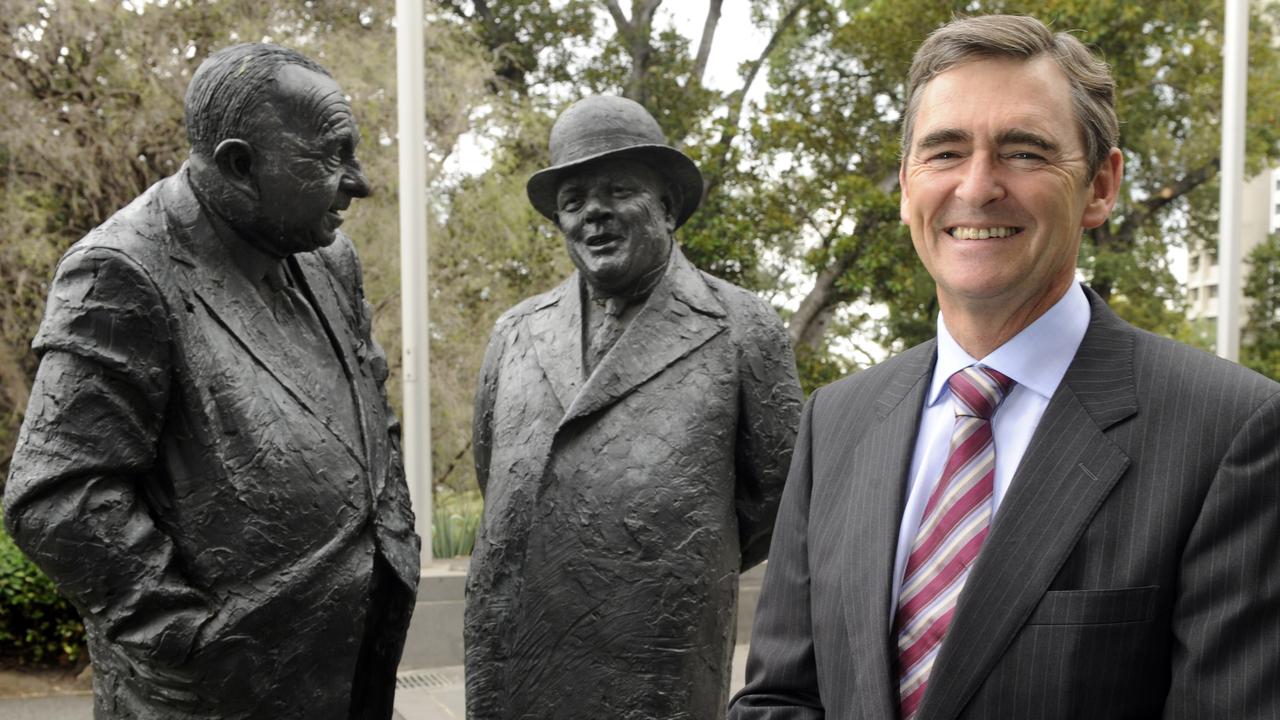 Former Victorian premier John Brumby with statues of past premiers Sir Henry Bolte and Sir Albert Dunstan outside the Premier’s office in Melbourne.