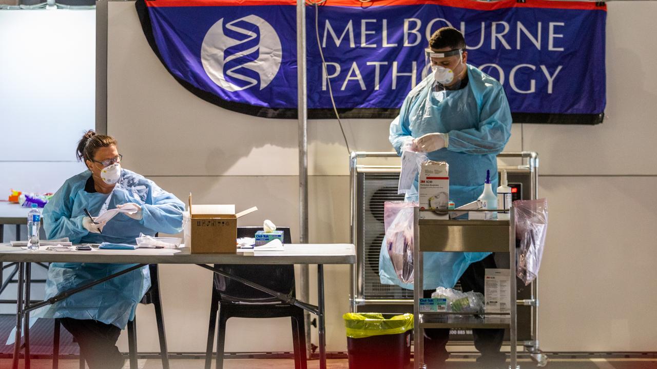 Health workers at a drive through clinic at Chadstone Shopping Centre in Melbourne. Picture: Asanka Ratnayake/Getty