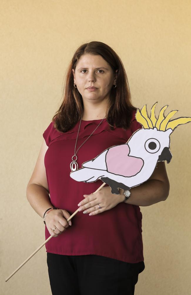 Supporter Angela Fredericks with a cockatoo with a love heart on its wing, which has become a symbol of the “home to Bilo” campaign. Picture: Mark Cranitch.