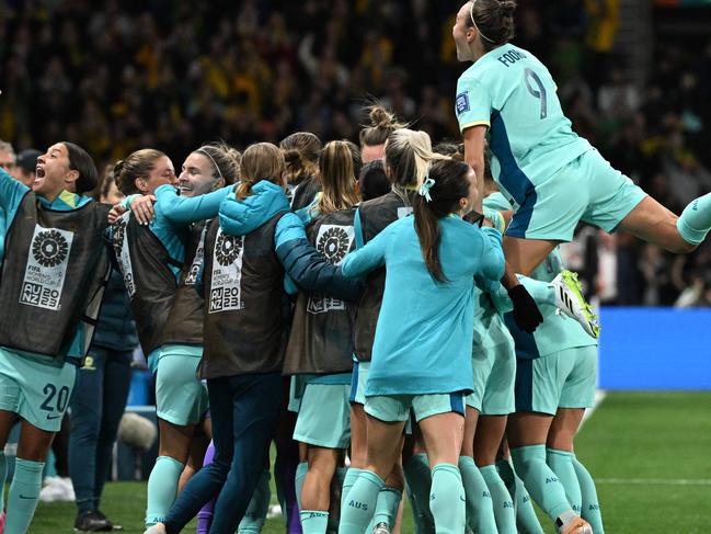 Australia's forward #20 Sam Kerr (L) celebrates after Australia's defender #07 Stephanie Catley (unseen) scored her team's fourth goal from the penalty kick during the Australia and New Zealand 2023 Women's World Cup Group B football match between Canada and Australia at Melbourne Rectangular Stadium, also known as AAMI Park, in Melbourne on July 31, 2023. (Photo by WILLIAM WEST / AFP)