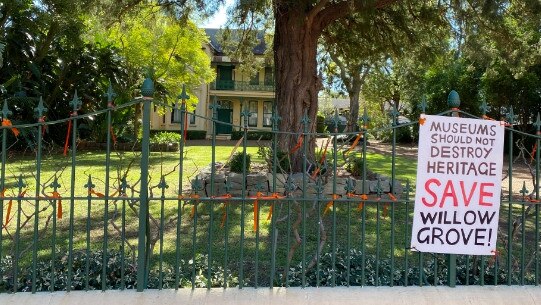 A sign opposes the demolition of Willow Grove at Phillip St to make way for the Powerhouse Museum.