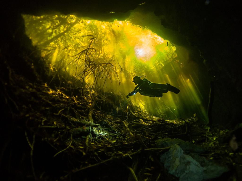 Tajma-Ha. Photographer: Joana Villar Year: 2018 “This photograph was taken while I was scuba diving in Cenote Tajma-Ha, Yucatan, Mexico. The yellowish colour of the water is obtained from the high levels of tannic acid there. I’m a PADI instructor and a certified full cave diver. These pictures were taken during a fun dive in the Cenotes.” Copyright: © Joana Villar, Portugal, Entry, Open, Landscape &amp; Nature, 2018 Sony World Photography Awards