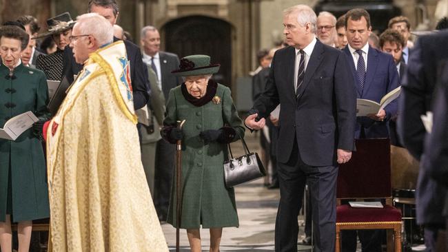 Prince Andrew escorts Queen Elizabeth into Westminster Abbey for the Duke of Edinburgh’s memorial. Picture: Getty Images.