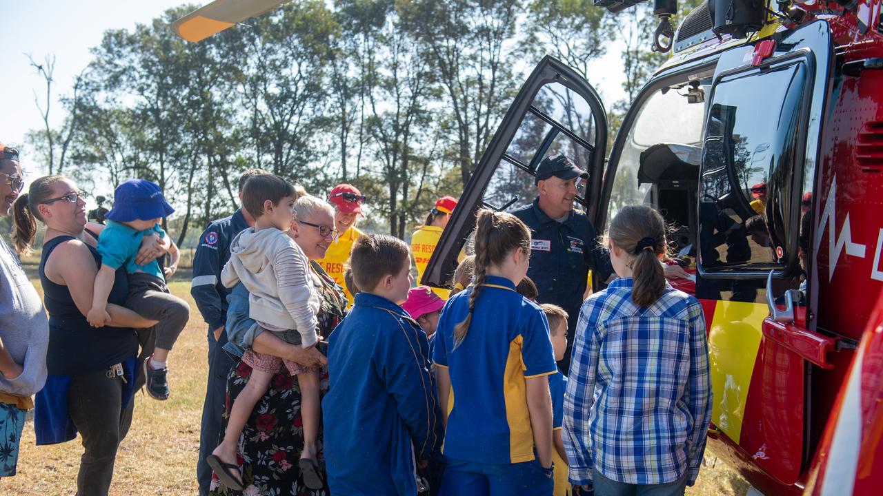 Mount Whitestone State School students check out the Surf Life Saving Queensland Westpac helicopter. PHOTO: ALI KUCHEL