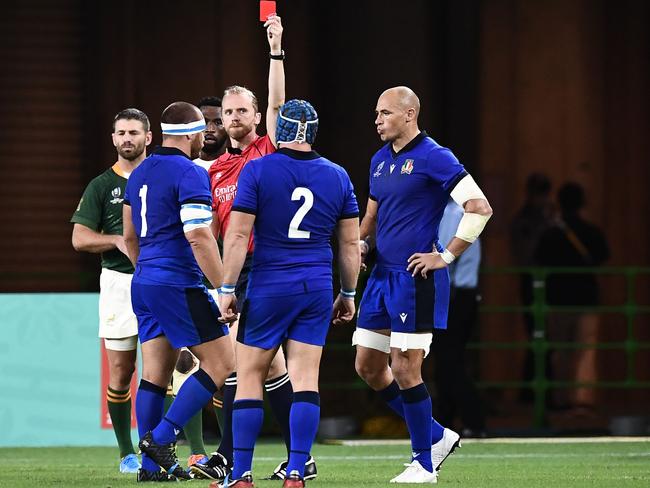 Italy’s prop Andrea Lovotti (second left) receives a red card for his dangerous tackle.