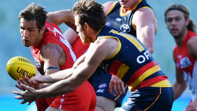 TOO STRONG: Veteran Swan Josh Kennedy wins another centre square clearance opposed to Crow Paul Seedsman at Adelaide Oval in round one. Picture: David Mariuz (AAP)