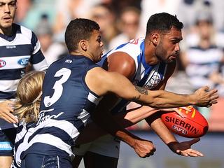 HOBART, AUSTRALIA - APRIL 24: Tarryn Thomas of the Kangaroos is challenged by Brandan Parfitt of the Cats during the round six AFL match between the North Melbourne Kangaroos and the Geelong Cats at Blundstone Arena on April 24, 2022 in Hobart, Australia. (Photo by Robert Cianflone/Getty Images)