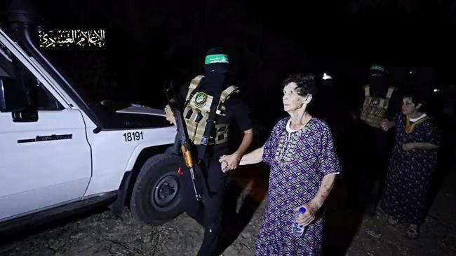 Yocheved Lifshitz and Nurit Cooper (also known as Nurit Yitzhak) who were held hostages by Palestinian Hamas militants, are released by the militants, in this video screengrab. Source: Twitter