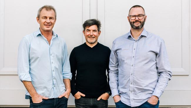 Upstock co-CEO Philip Fierlinger, centre, with founder and director Matt Watson, left, and co-CEO Duncan Ritchie.