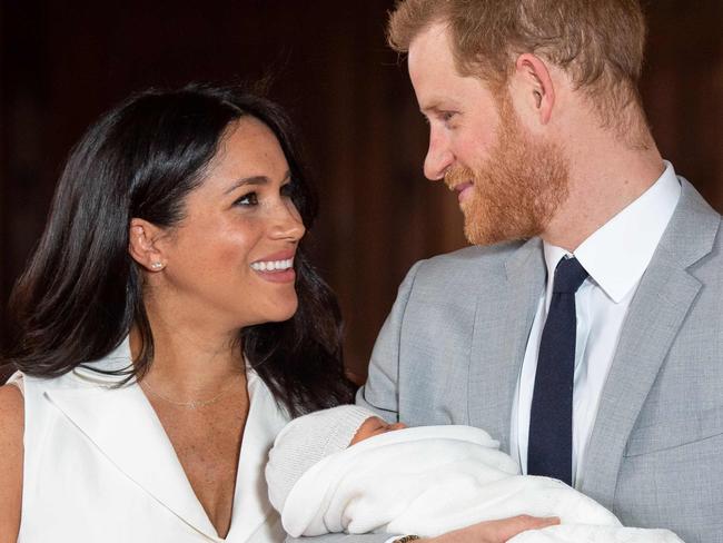 Britain's Prince Harry, Duke of Sussex (R), and his wife Meghan, Duchess of Sussex, pose for a photo with their newborn baby son in St George's Hall at Windsor Castle in Windsor, west of London on May 8, 2019. (Photo by Dominic Lipinski / POOL / AFP)