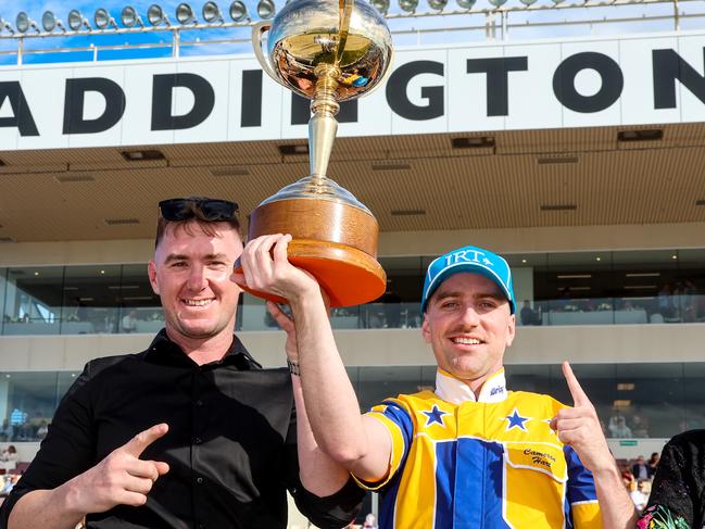 Trainer Jason Grimson and driver Cam Hart celebrate Swayzee's NZ Cup victory. Picture: HRNZ