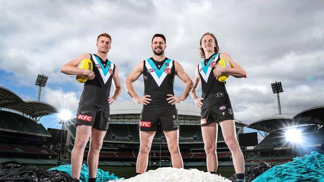 Port Adelaide’s Travis Boak, Willem Drew and Miles Bergman. Picture: Sarah Reed/Getty Images