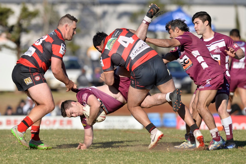 Zachary Morris of Dalby Diehards is tackled by Valleys Roosters in TRL Premiership qualifying final rugby league at Glenholme Park, Sunday, August 12, 2018. Picture: Kevin Farmer