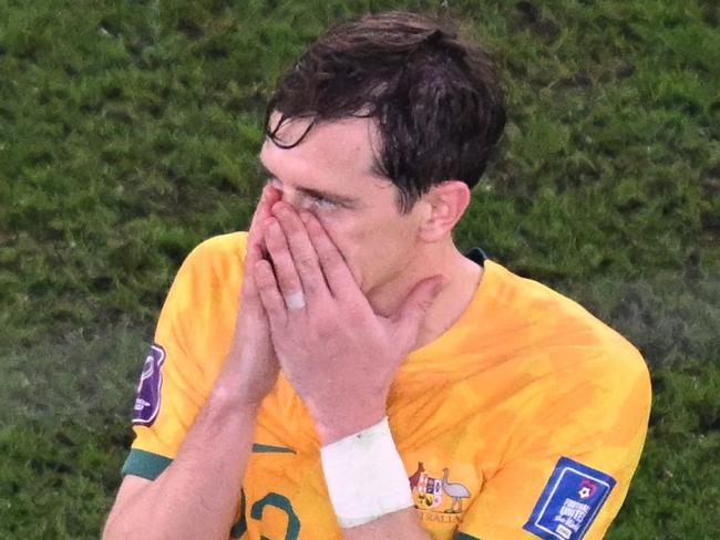 Australia's midfielder #23 Craig Goodwin reacts at the end of the Qatar 2022 World Cup round of 16 football match between Argentina and Australia at the Ahmad Bin Ali Stadium in Al-Rayyan, west of Doha on December 3, 2022. (Photo by Kirill KUDRYAVTSEV / AFP)