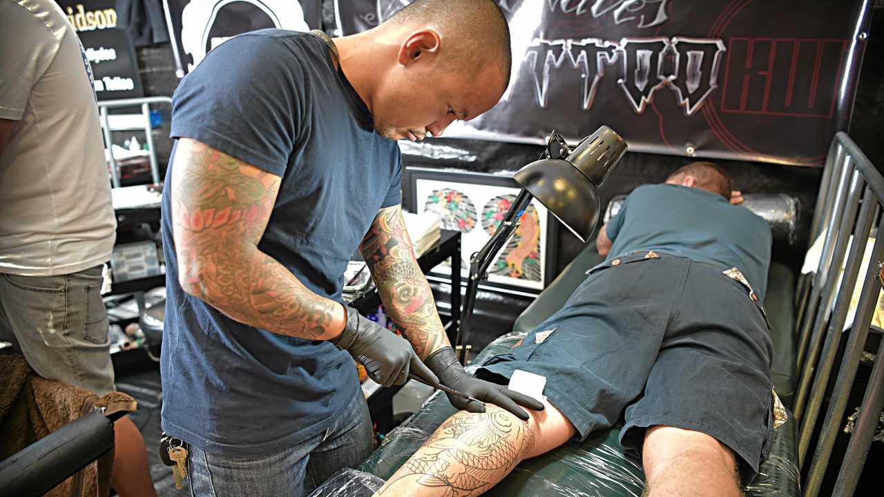 Coast artist's niche, traditional 'hand carving' tattoo style | The Courier  Mail