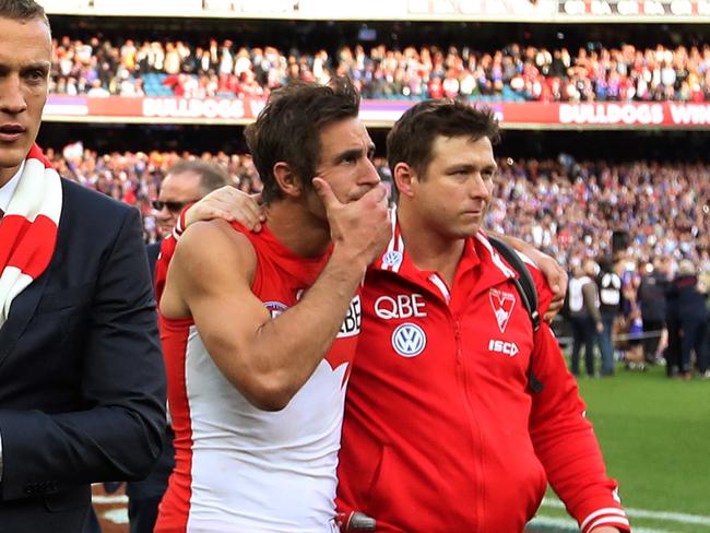 Dew comforts Josh Kennedy after last year’s grand final loss. Picture: Phil Hillyard