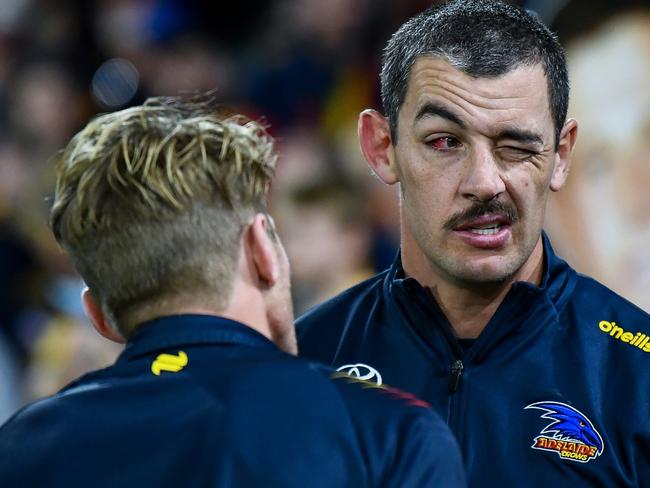 ADELAIDE, AUSTRALIA - AUGUST 11:  Rory Sloane of the Crows looks at  Taylor Walker of the Crows injured  eye after  the round 22 AFL match between Adelaide Crows and Western Bulldogs at Adelaide Oval, on August 11, 2024, in Adelaide, Australia. (Photo by Mark Brake/Getty Images)