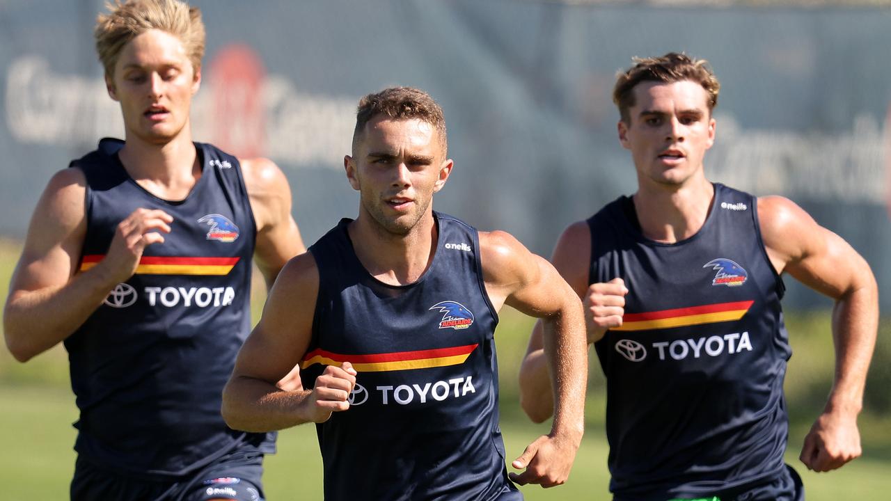 Lachlan Sholl leads a running drill at Adelaide training.