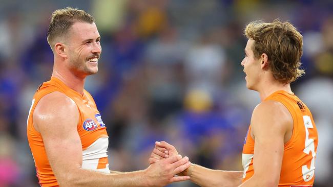 Kieren Briggs (left) says he’s confident Aussie rules can continue to grow in western Sydney, where he once accidentally discovered the game. Picture: James Worsfold / Getty Images