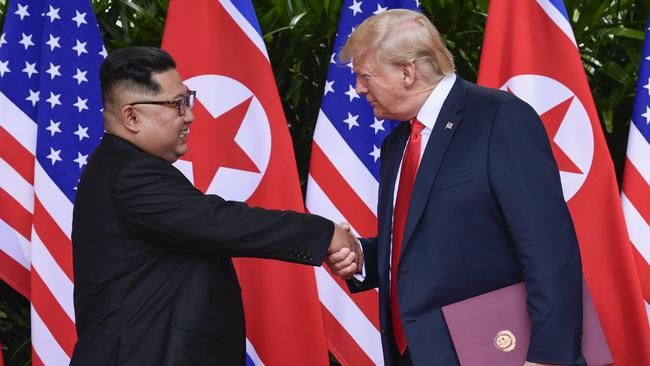 Kim Jong-un and Donald Trump at their groundbreaking first meeting in Singapore last year. Picture: AP 